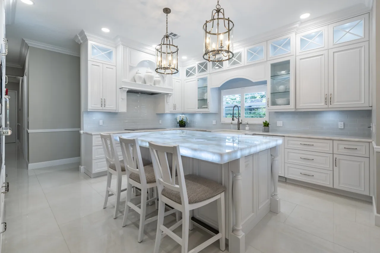 Custom kitchen with a lit island, designed and built by Wolf in the Woods