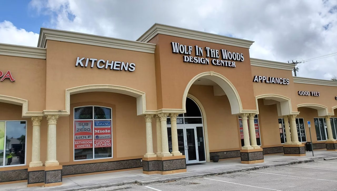 Wolf in the Woods Design Center storefront in Davie, Florida, with Kitchens and Appliances signage