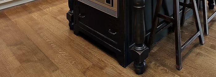 Hardwood flooring in a warm honey oak finish with visible grain