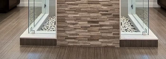 Laminate flooring in a deep grey-brown wood-look finish