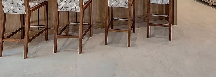 Large-format porcelain tile flooring in a soft cream finish