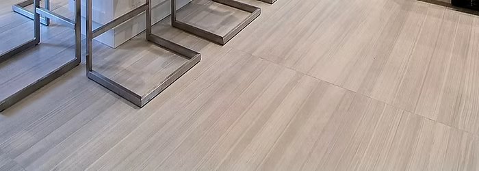 Large-format tile flooring with a fine linear stone texture